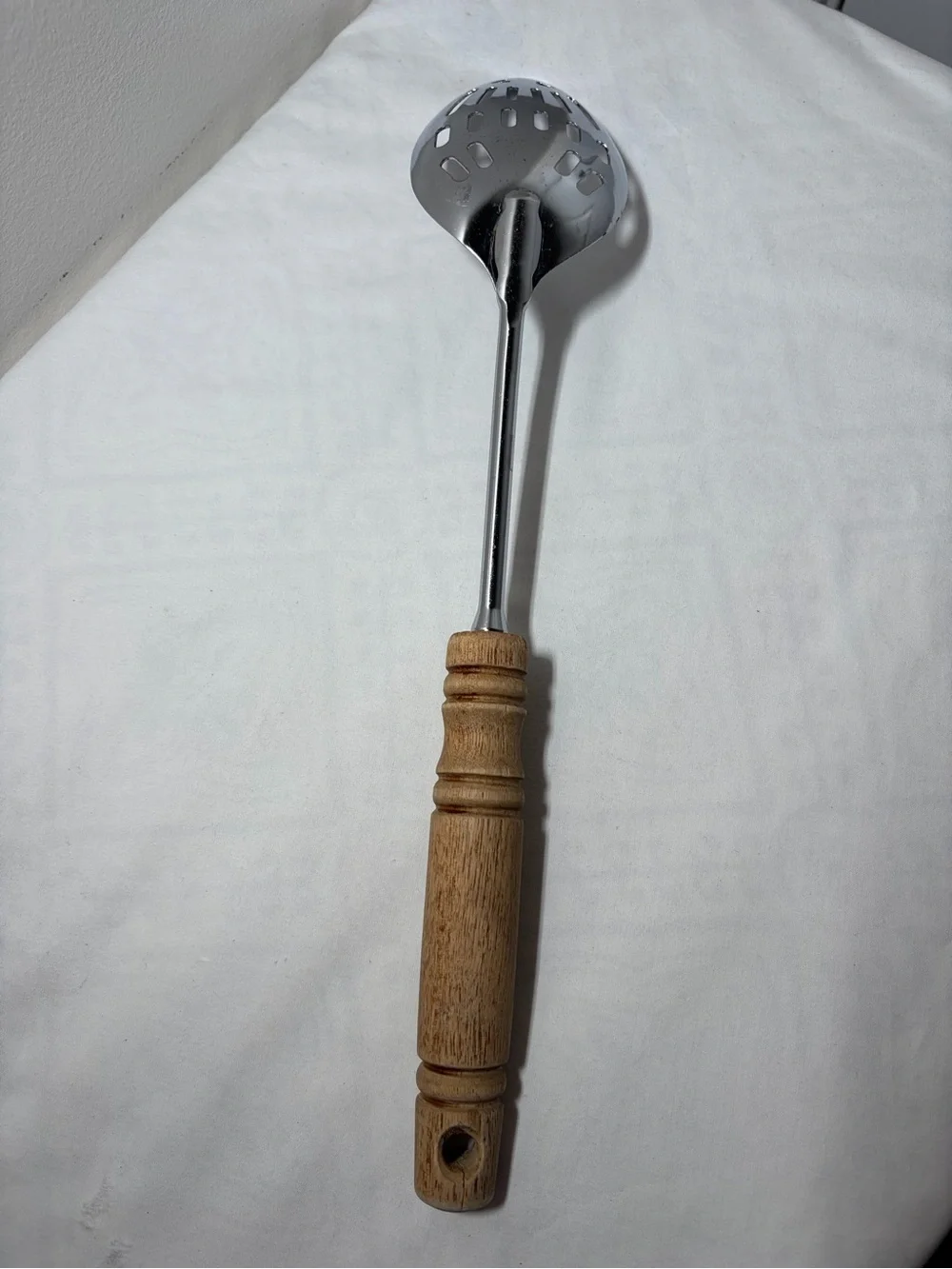 EKCO Stainless Steel Slotted Spoon, Brown Wood Handle, Silver Solid Pattern
